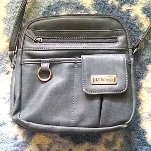 Multi Sac: Blue cross body bag. Many outer and inner compartments.